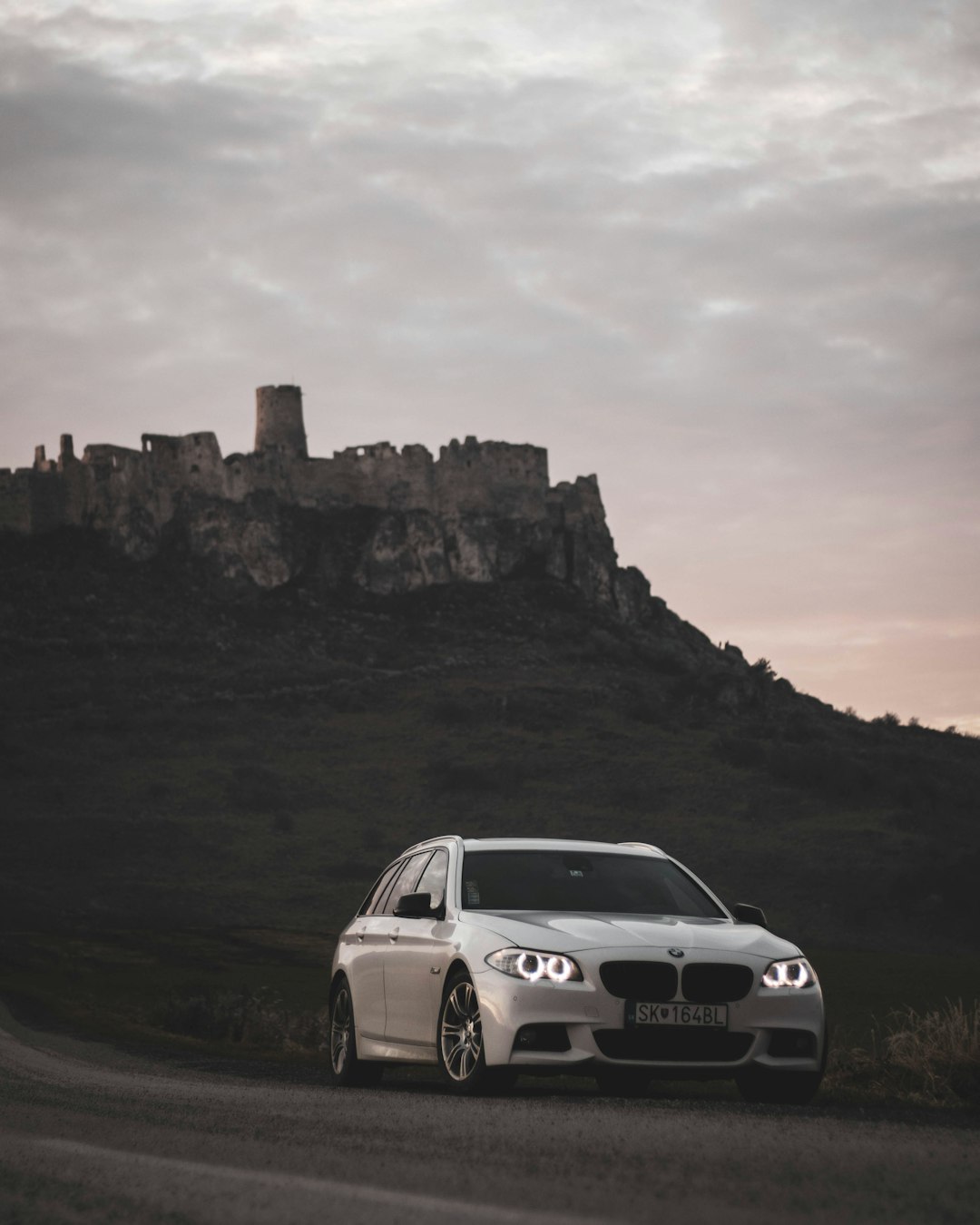 white bmw m 3 on road during daytime