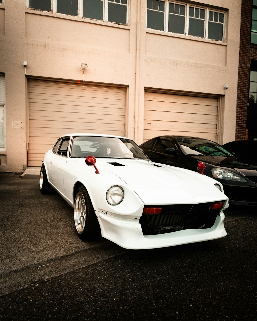 white porsche 911 parked in garage