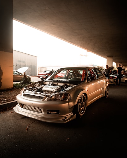 white bmw m 3 parked in front of building