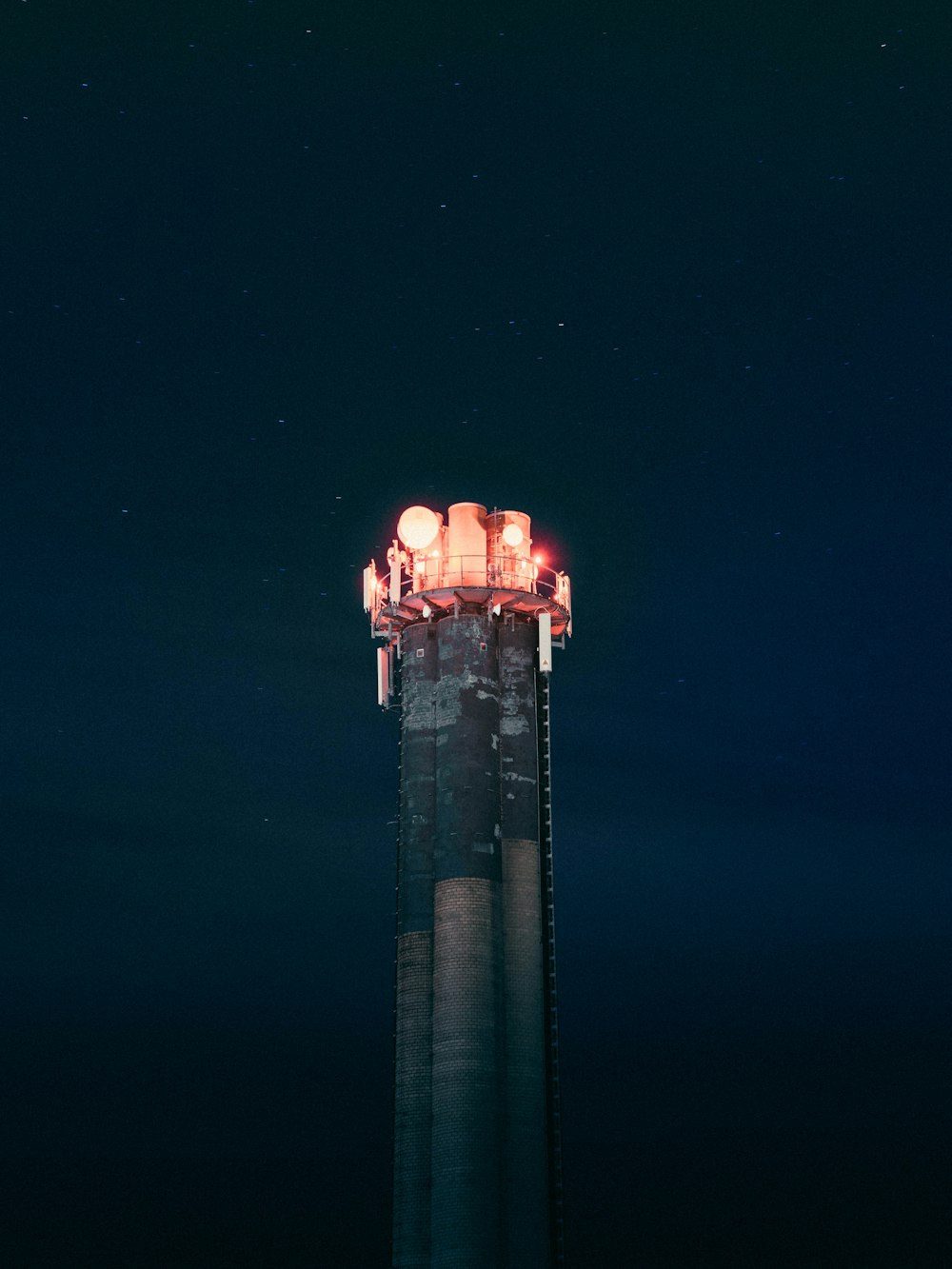 lighted gray tower during night time