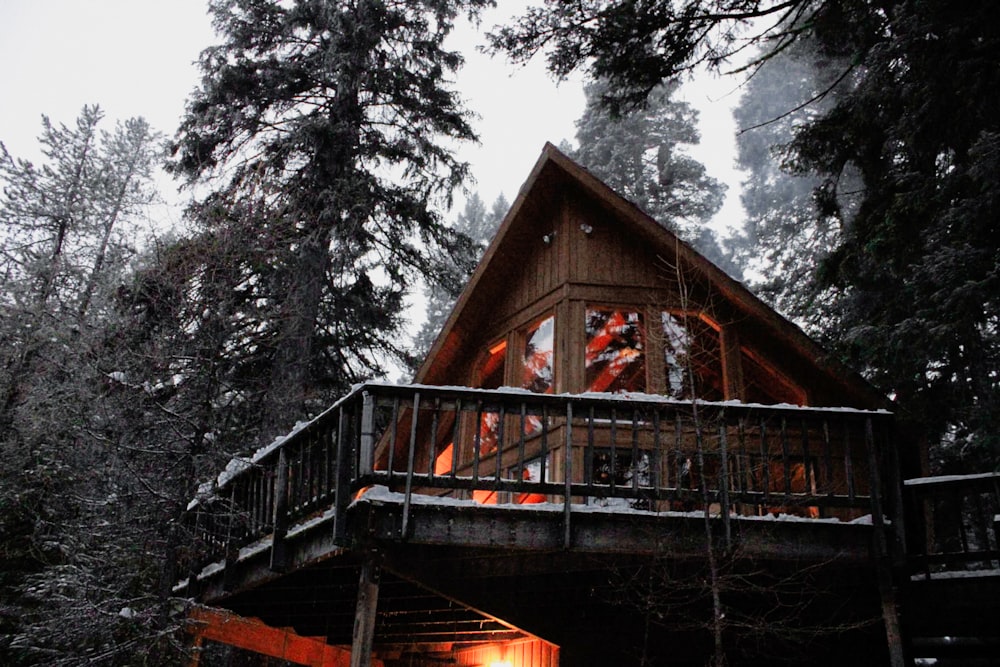 brown wooden house near trees during daytime