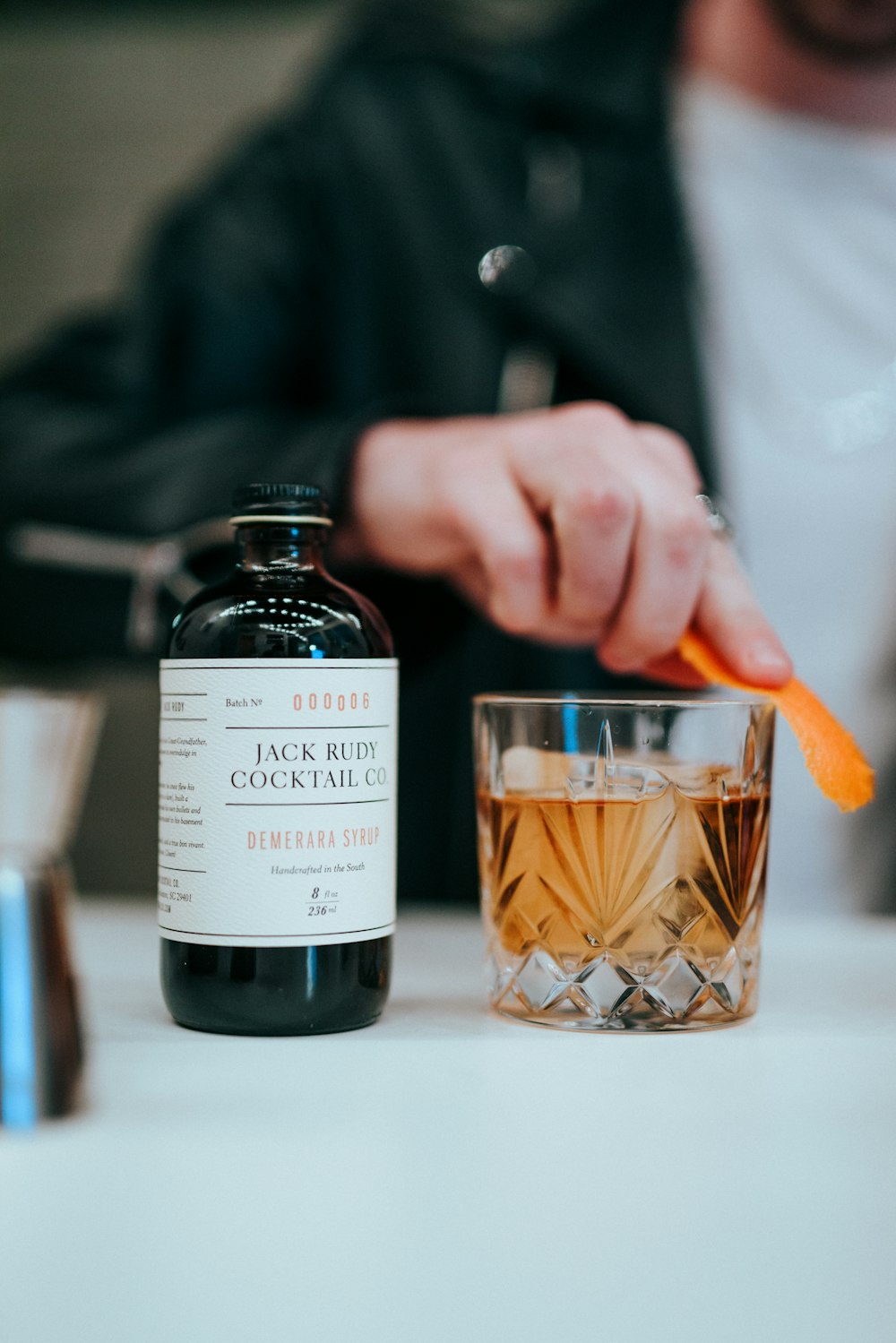 clear drinking glass with brown liquid inside