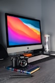 black dslr camera on brown wooden table