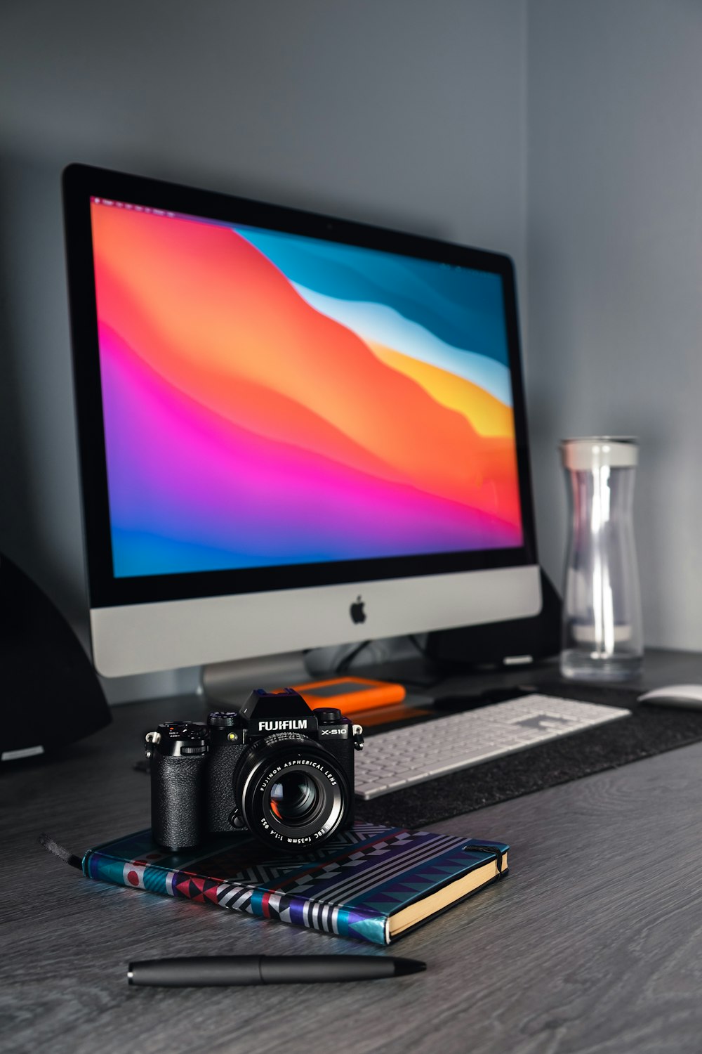 black dslr camera on brown wooden table