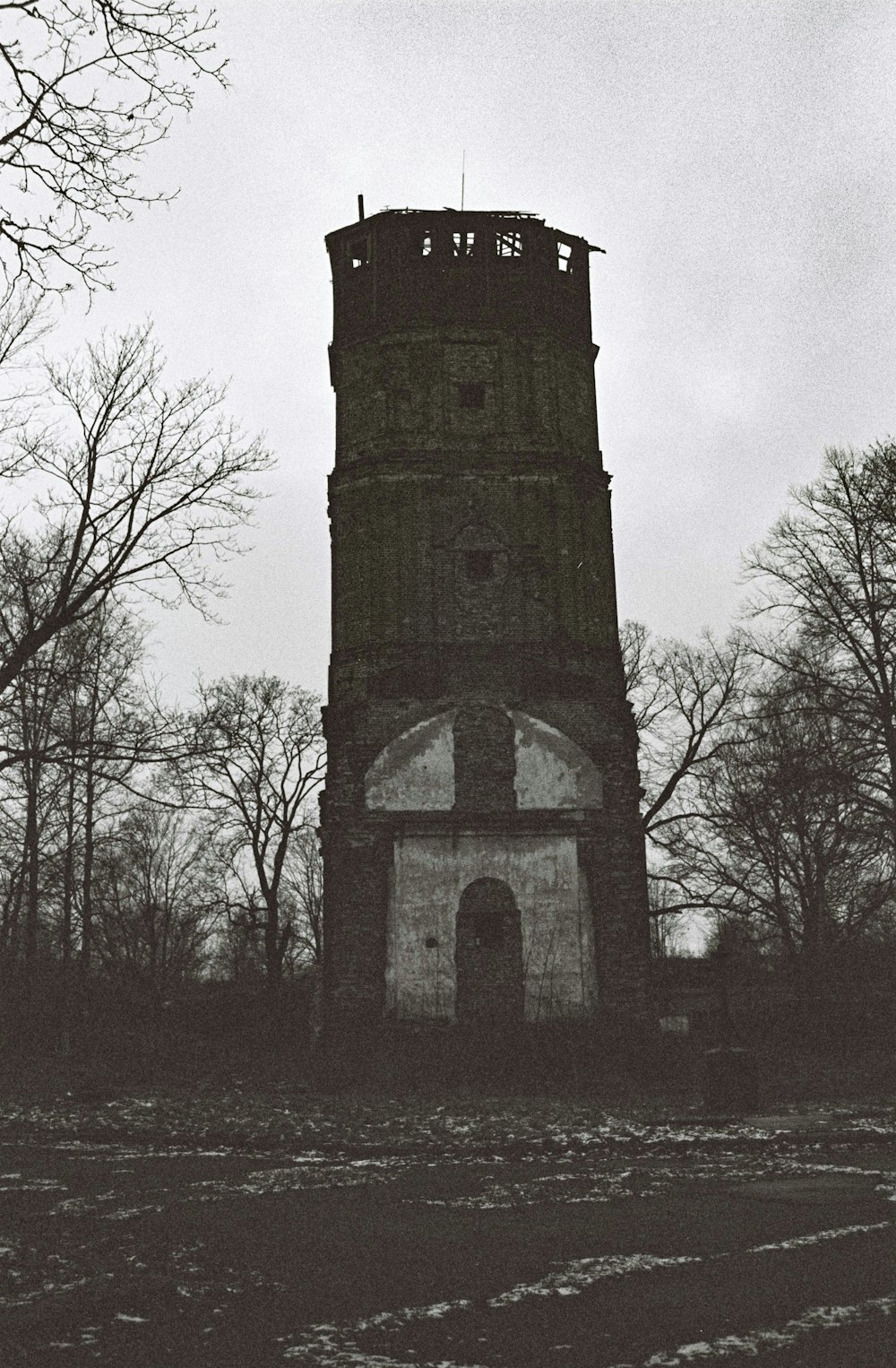 black and white tower under gray sky