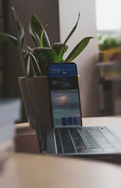 A cozy home setting with a laptop and smartphone connected to the internet, symbolizing basic plan usage.