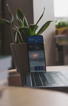 A cozy home setting with a laptop and smartphone connected to the internet, symbolizing basic plan usage.