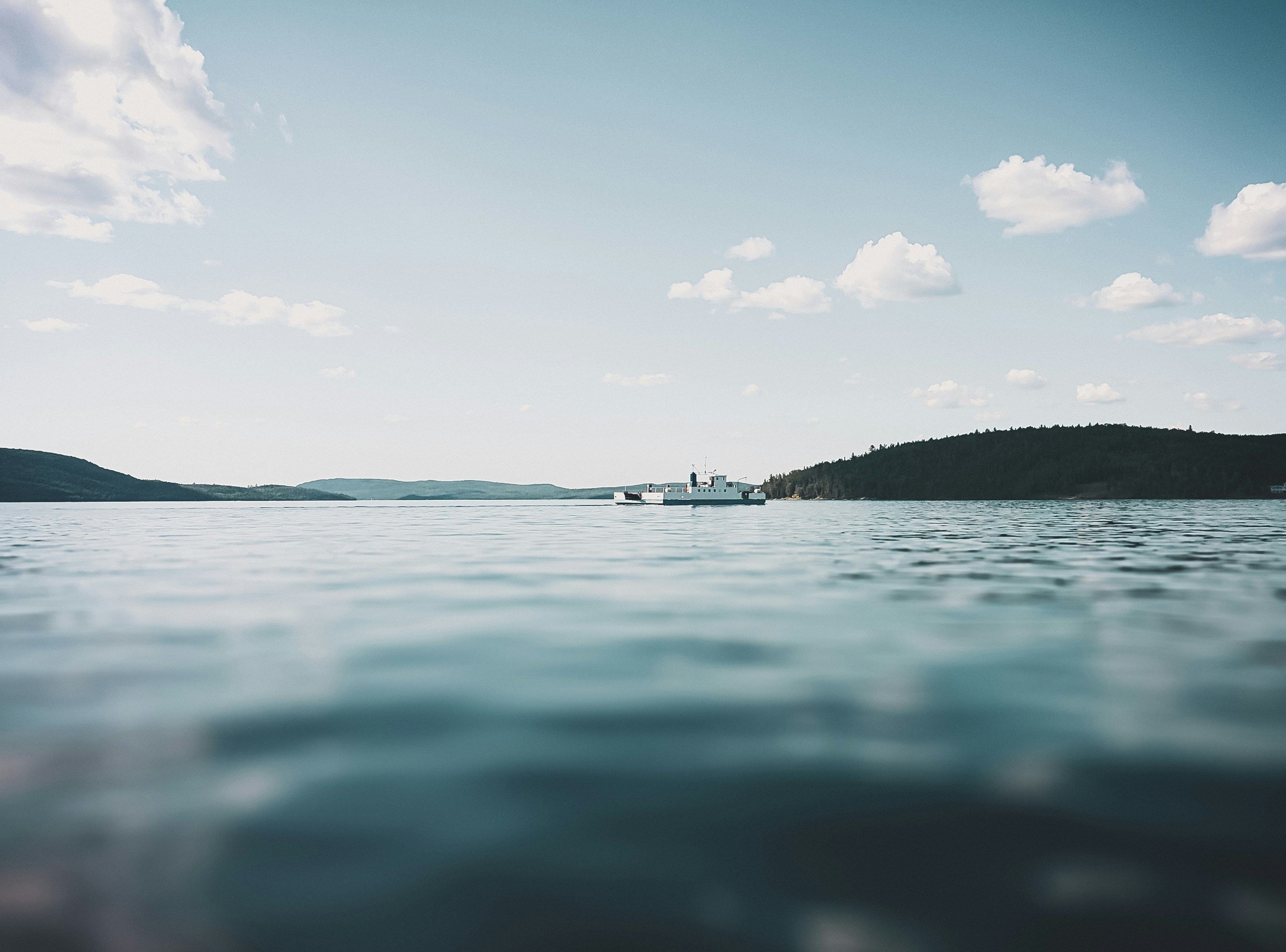 body of water under blue sky during daytime