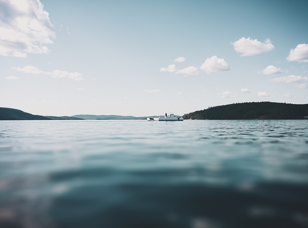 body of water under blue sky during daytime