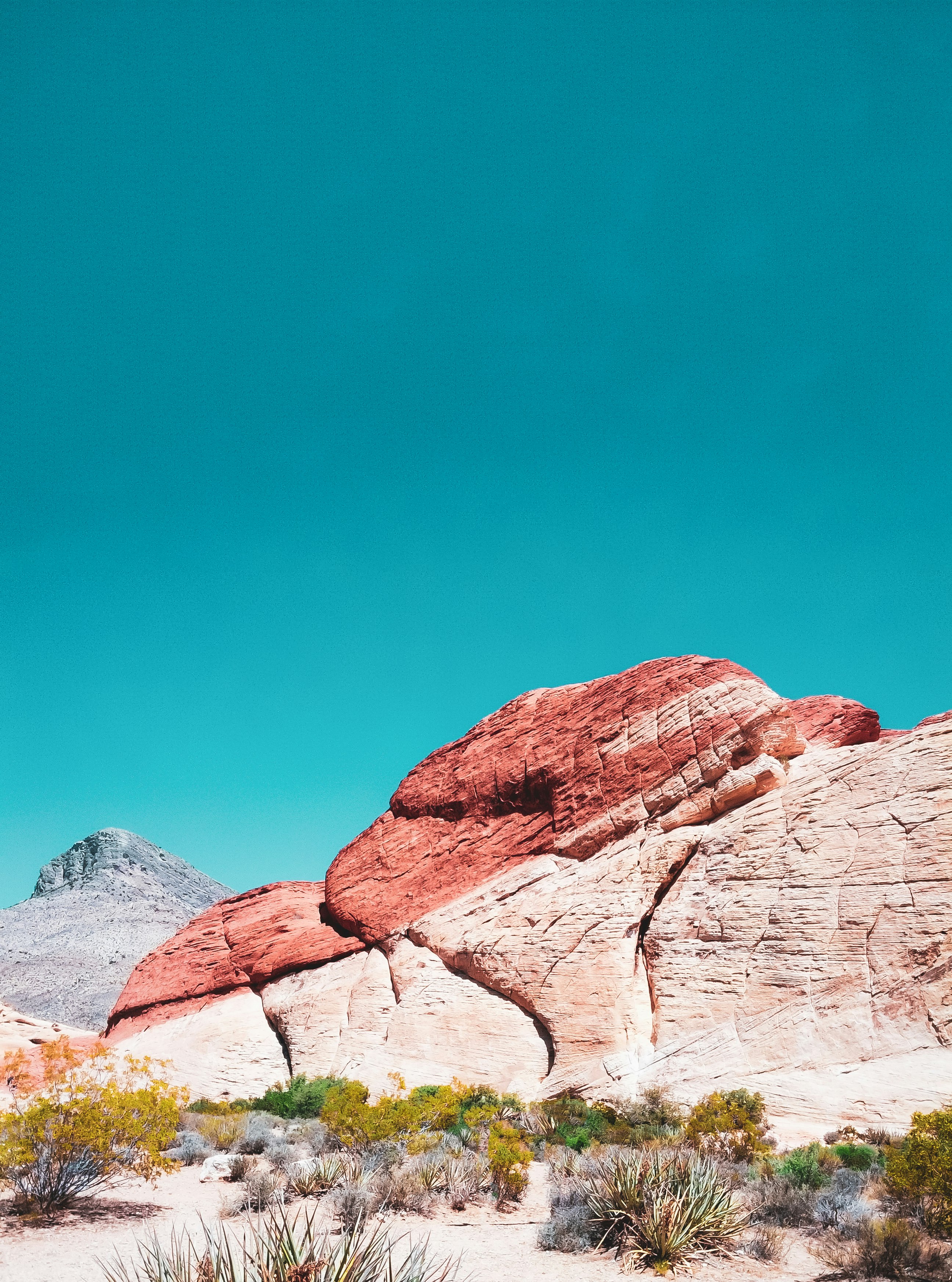 brown rocky mountain under blue sky during daytime