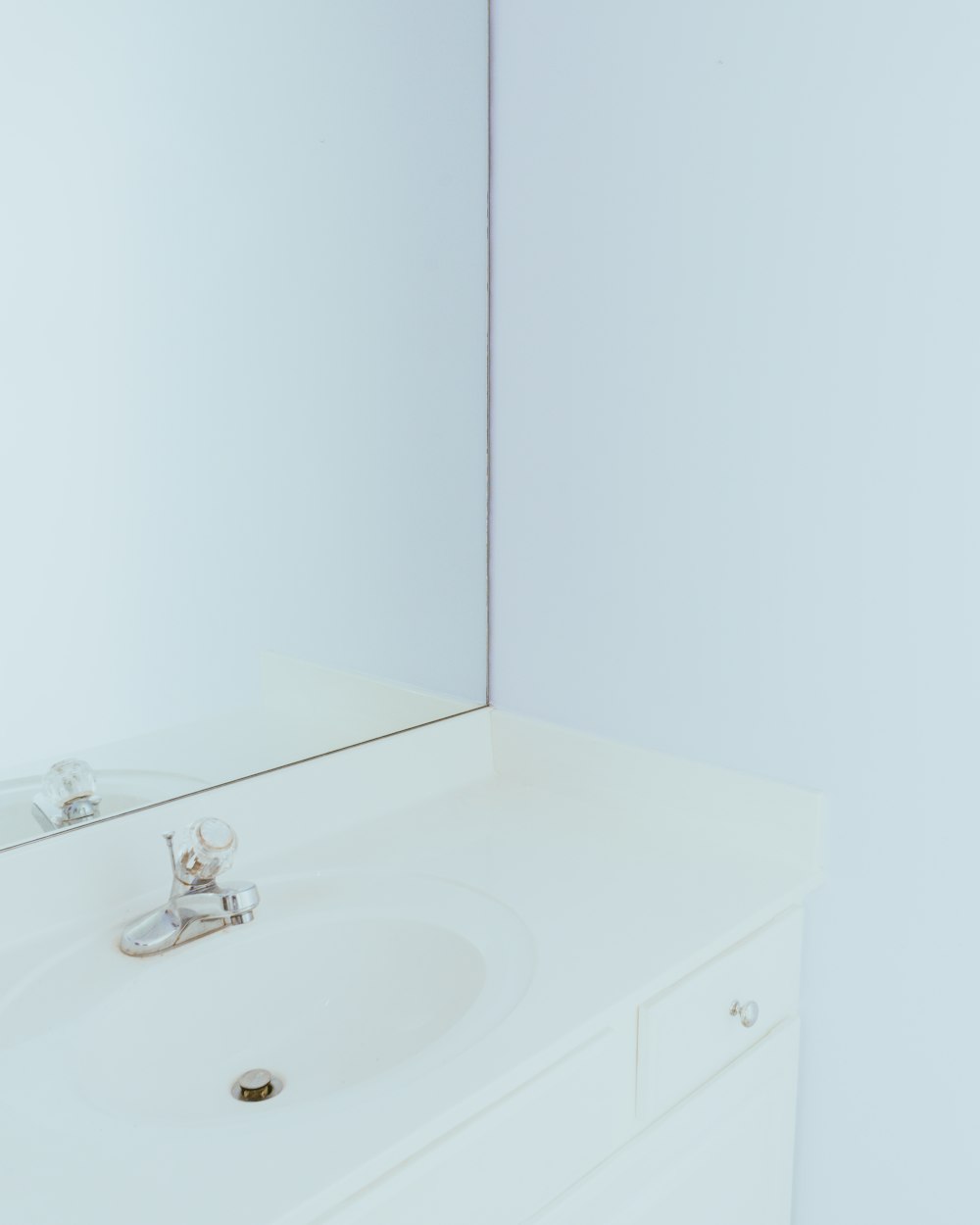 white ceramic sink with faucet