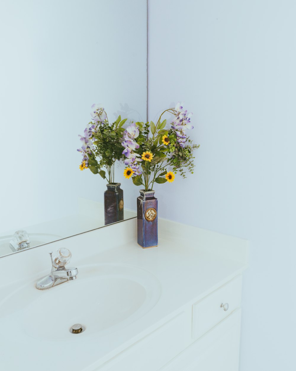 white ceramic sink with stainless steel faucet