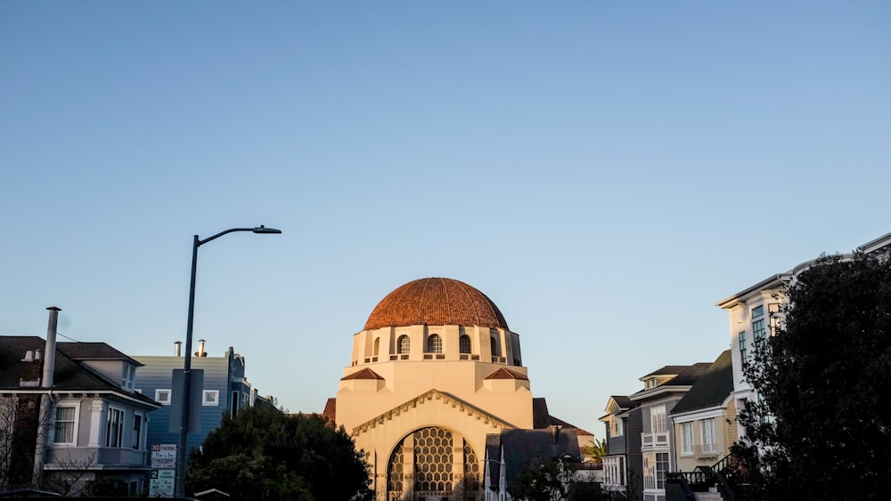 brown dome building under blue sky during daytime