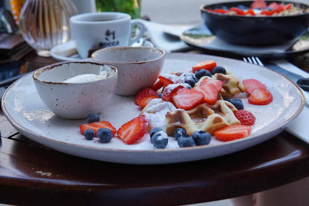 sliced strawberries on white ceramic bowl