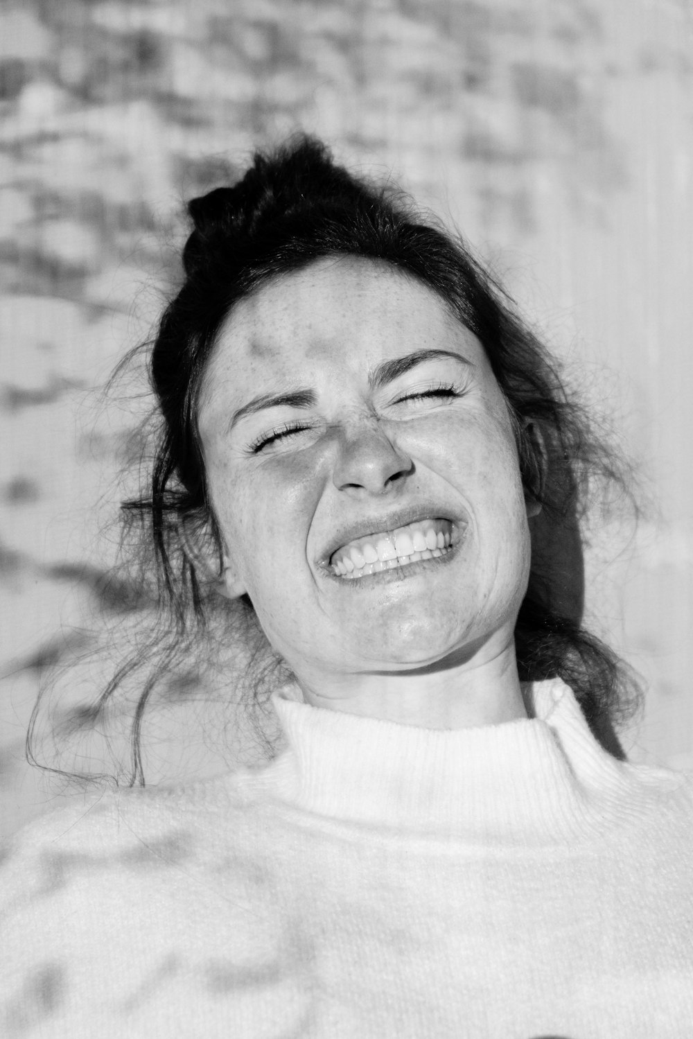 smiling woman in white crew neck shirt