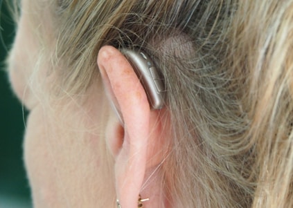 woman wearing silver hoop earrings