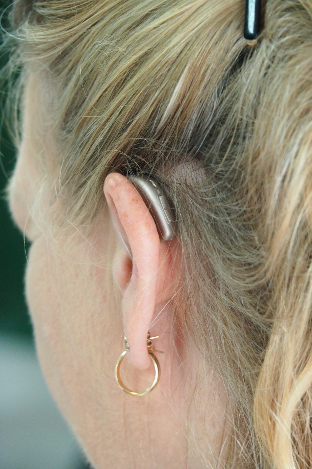 woman wearing silver hoop earrings