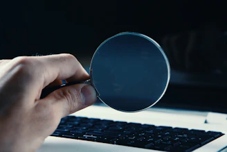 person holding round blue frame