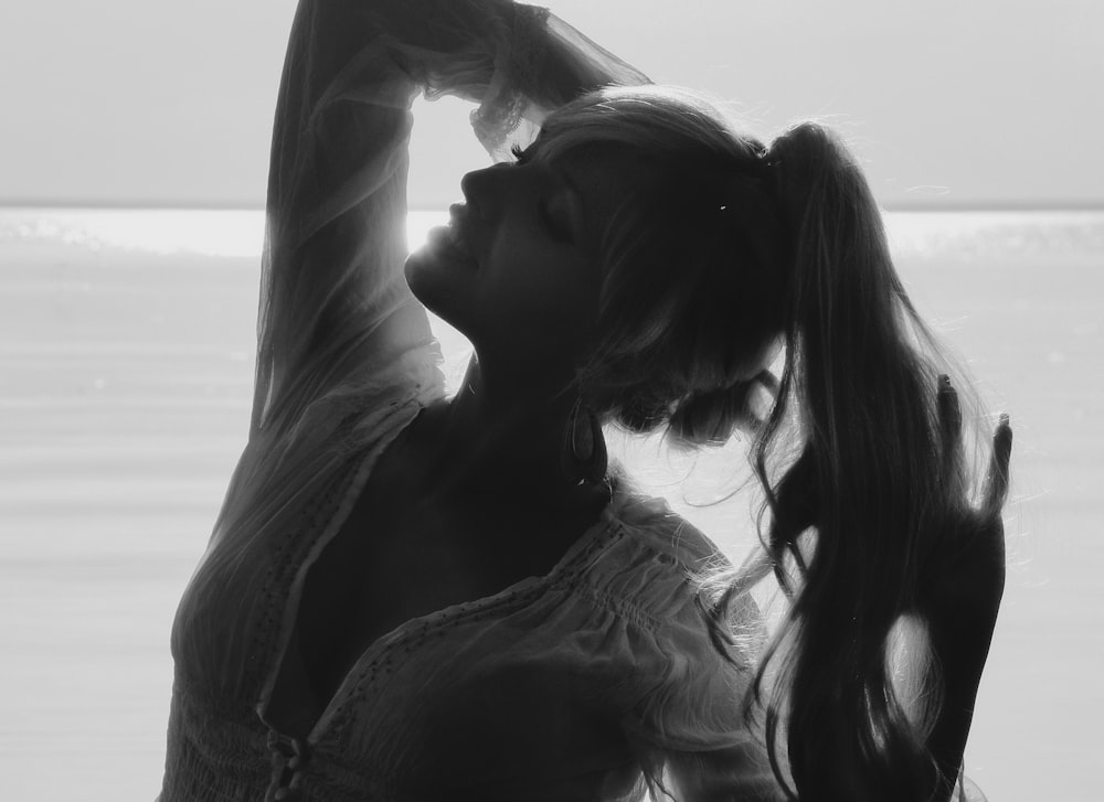 woman in white long sleeve shirt kissing womans cheek