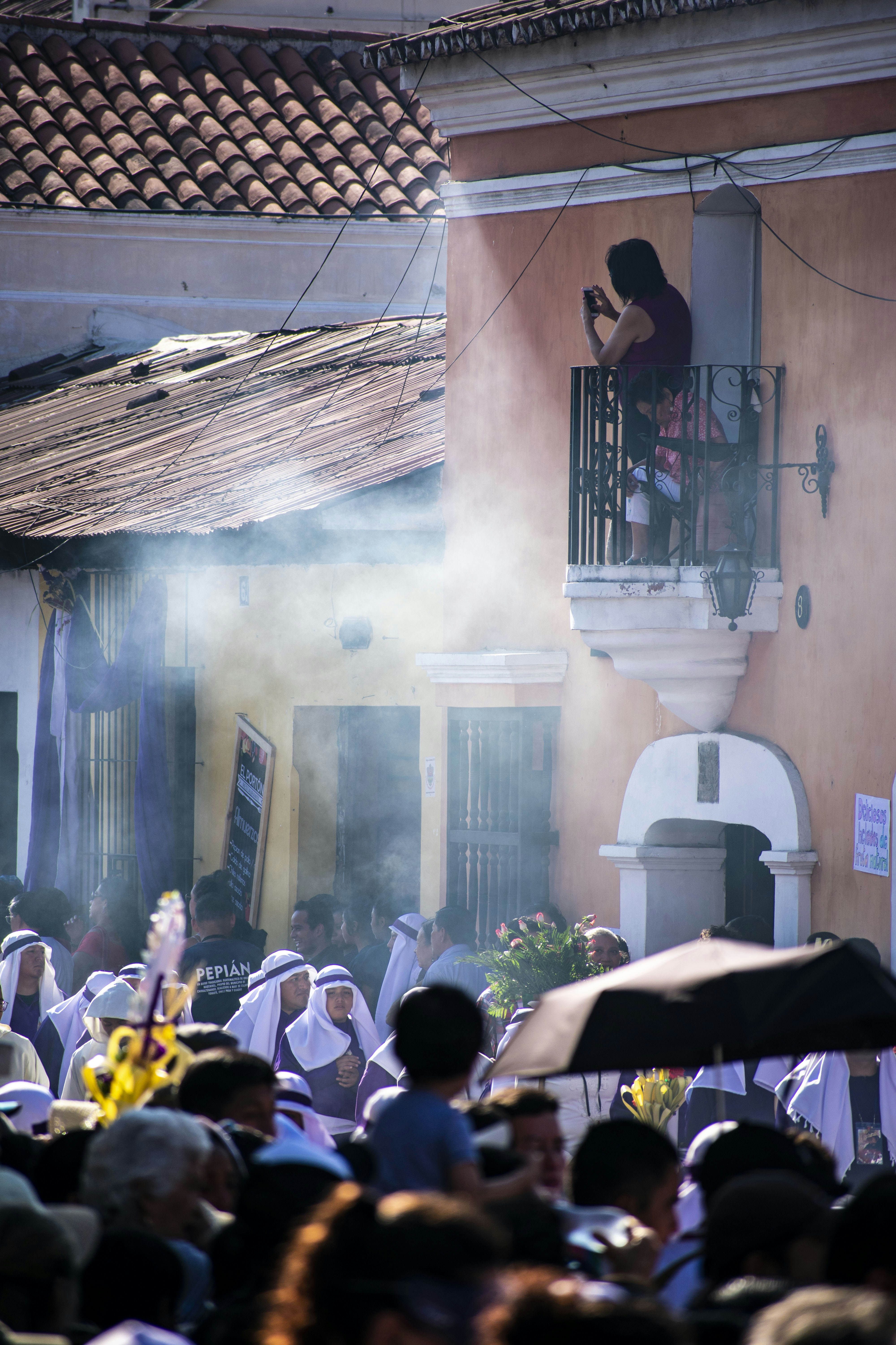 people gathering on a street during daytime