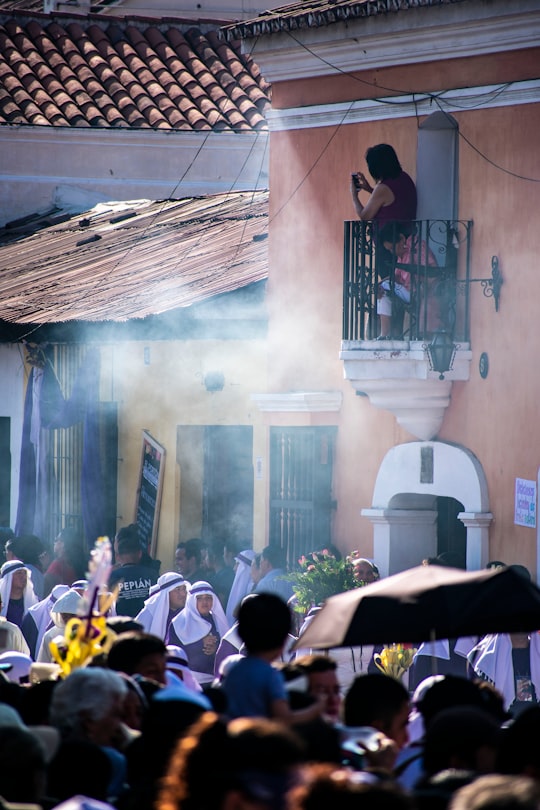 people gathering on a street during daytime in Antigua Guatemala Guatemala