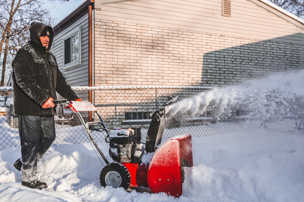 red and black ride on toy car on snow covered ground