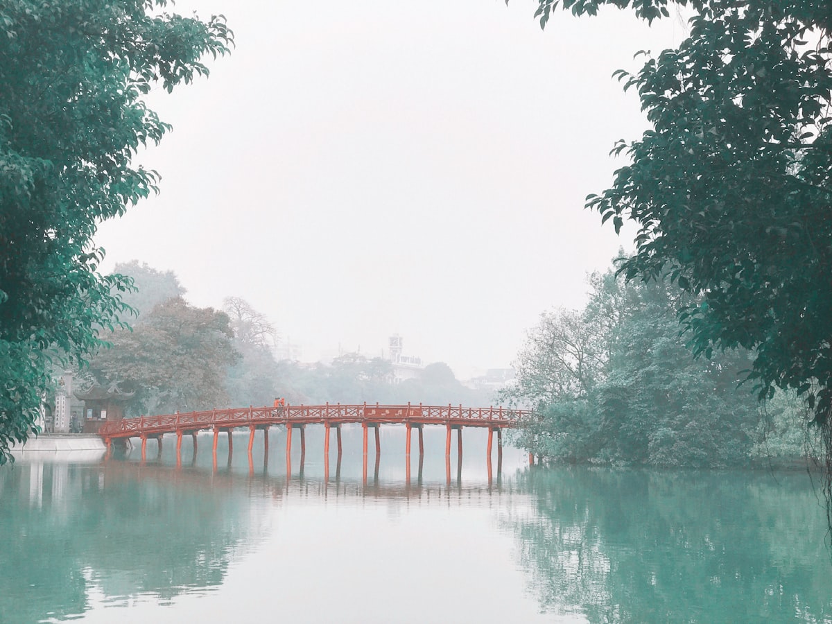 Hanoi February — The Huc Bridge at Hoan Kiem Lake in winter, decorated for Tet Lunar New Year