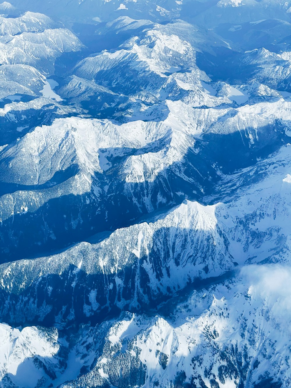 snow covered mountain during daytime