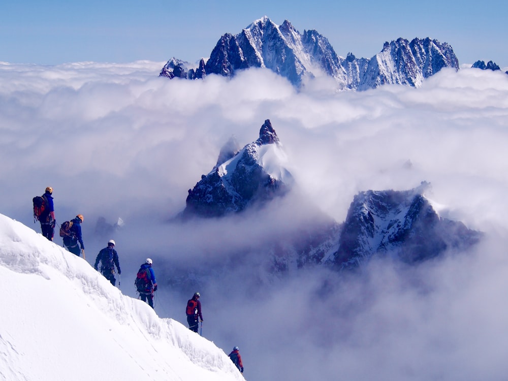 people on snow covered mountain during daytime