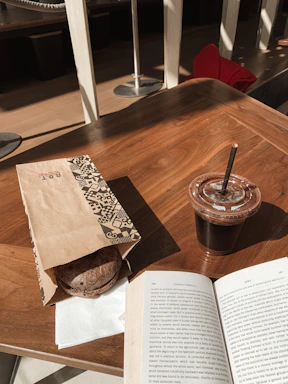 Warm, sunlit Italian kitchen table with handwritten letters and a steaming cup of espresso