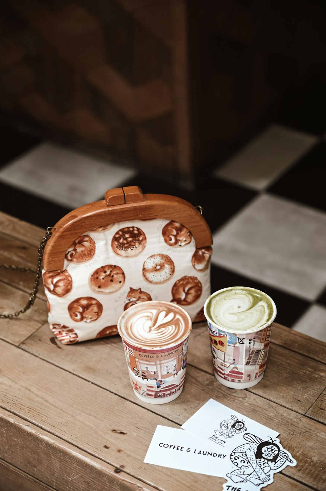 two white and brown plastic cups on brown wooden table