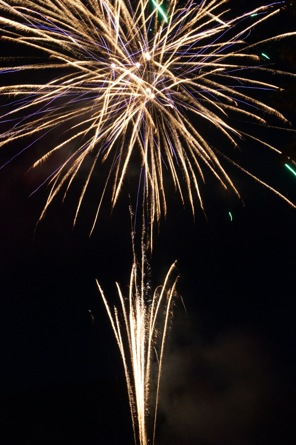 white and yellow fireworks in the sky