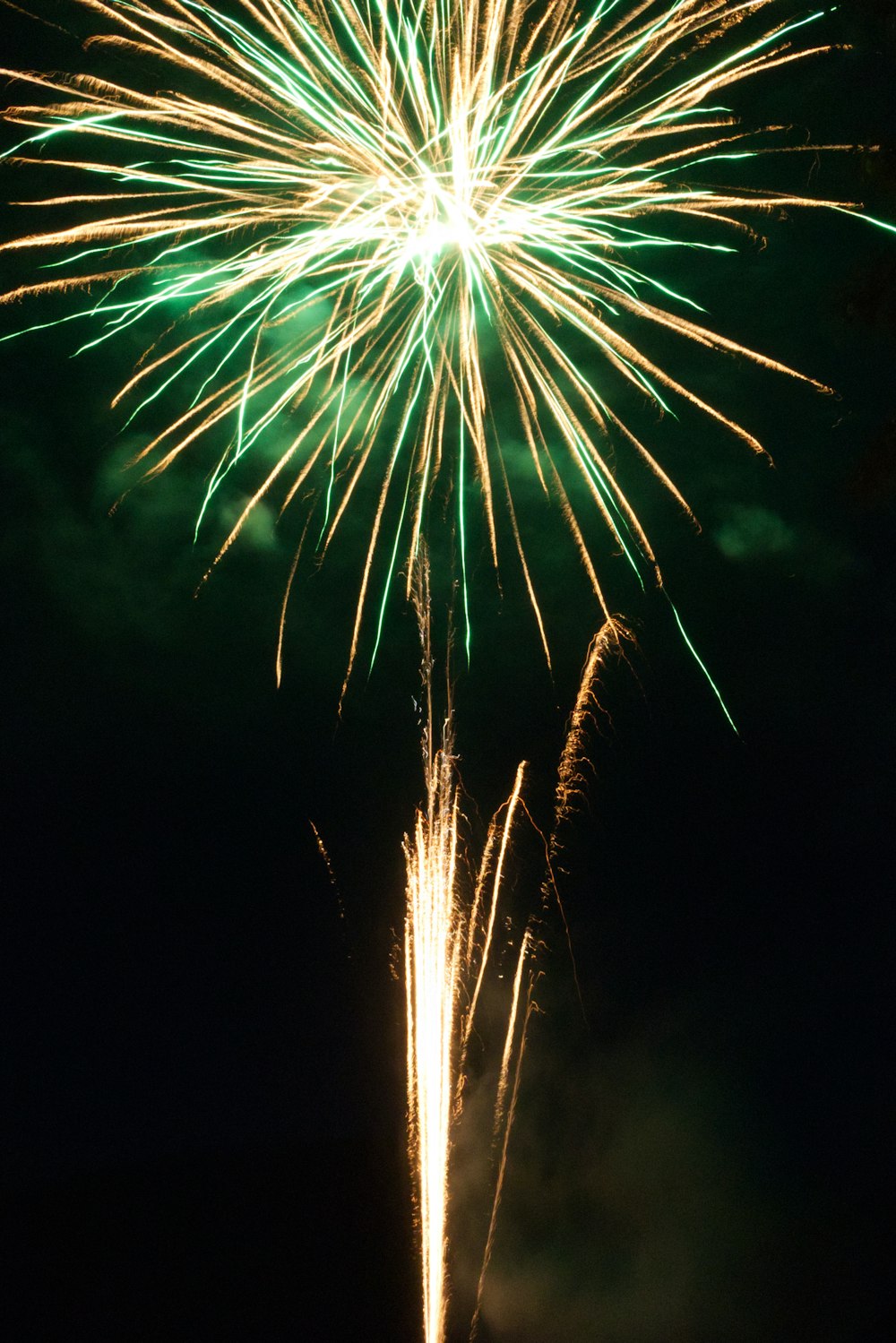 green and yellow fireworks during nighttime