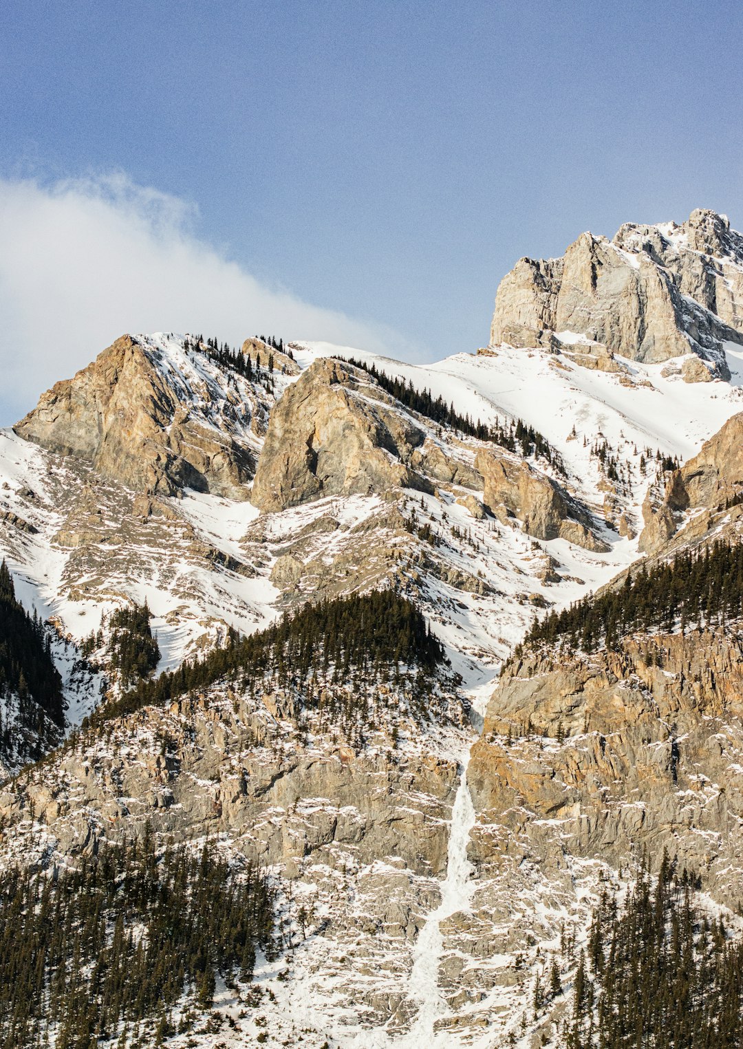 brown rocky mountain under blue sky during daytime