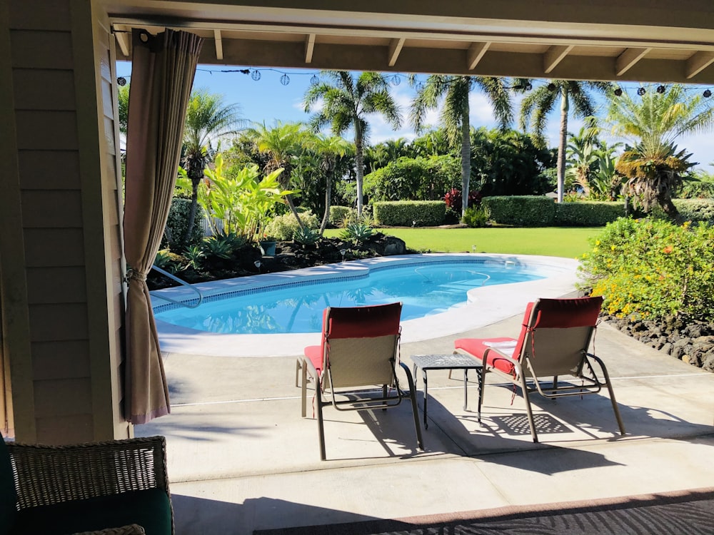 swimming pool with chairs and tables