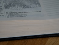 An open journal showing detailed editorial notes and annotations on a research article.