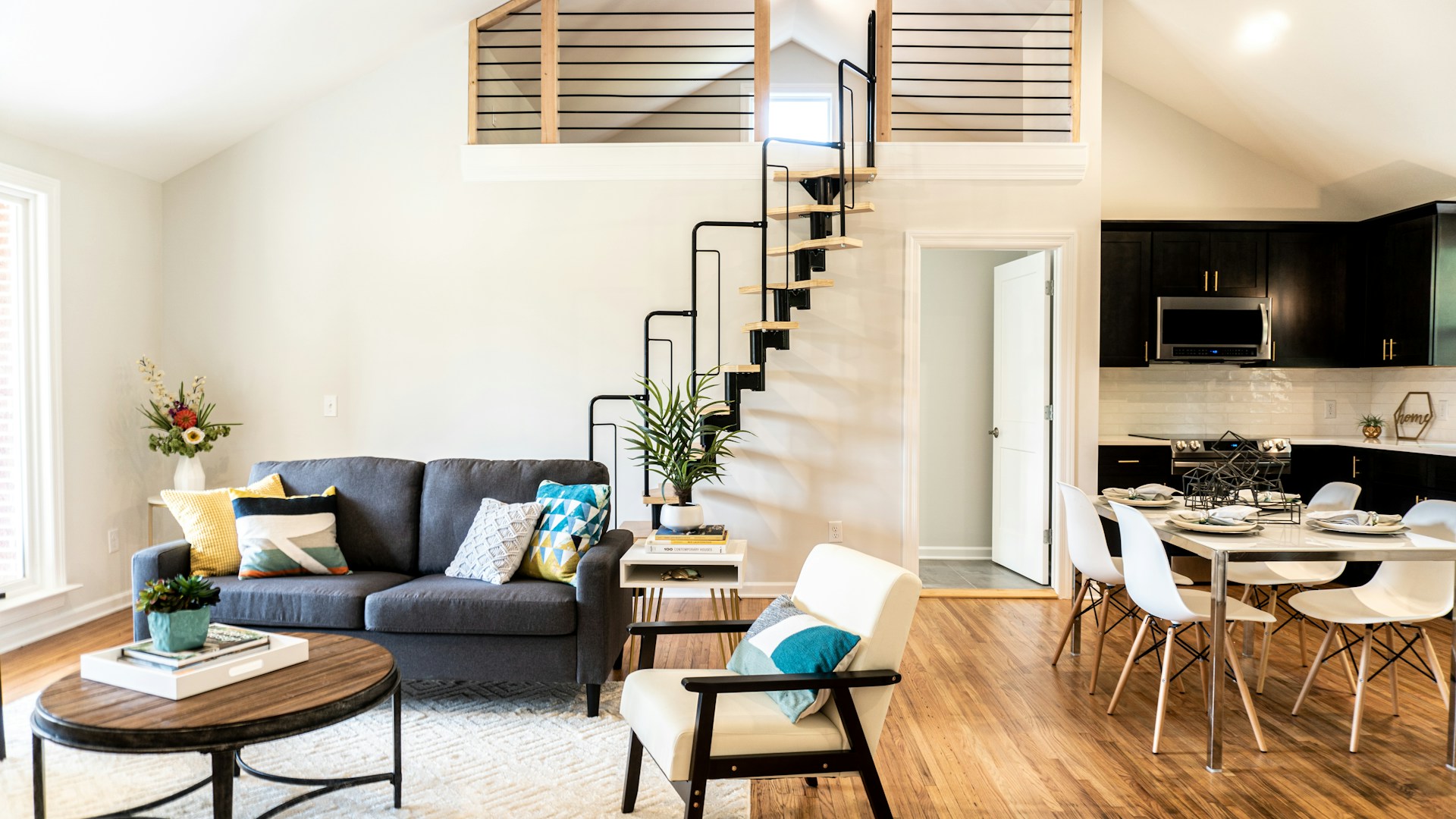 gray sofa beside white wall