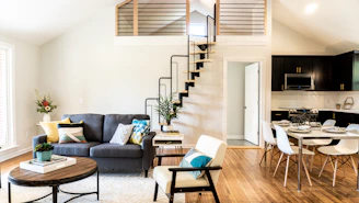 gray sofa beside white wall