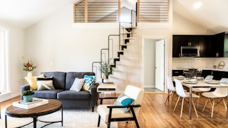 gray sofa beside white wall