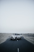 white suv on gray asphalt road