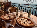 An inviting table setting at Pirata's Pizza with a variety of pizzas and a cozy atmosphere.