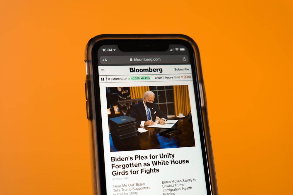 black samsung android smartphone on orange table