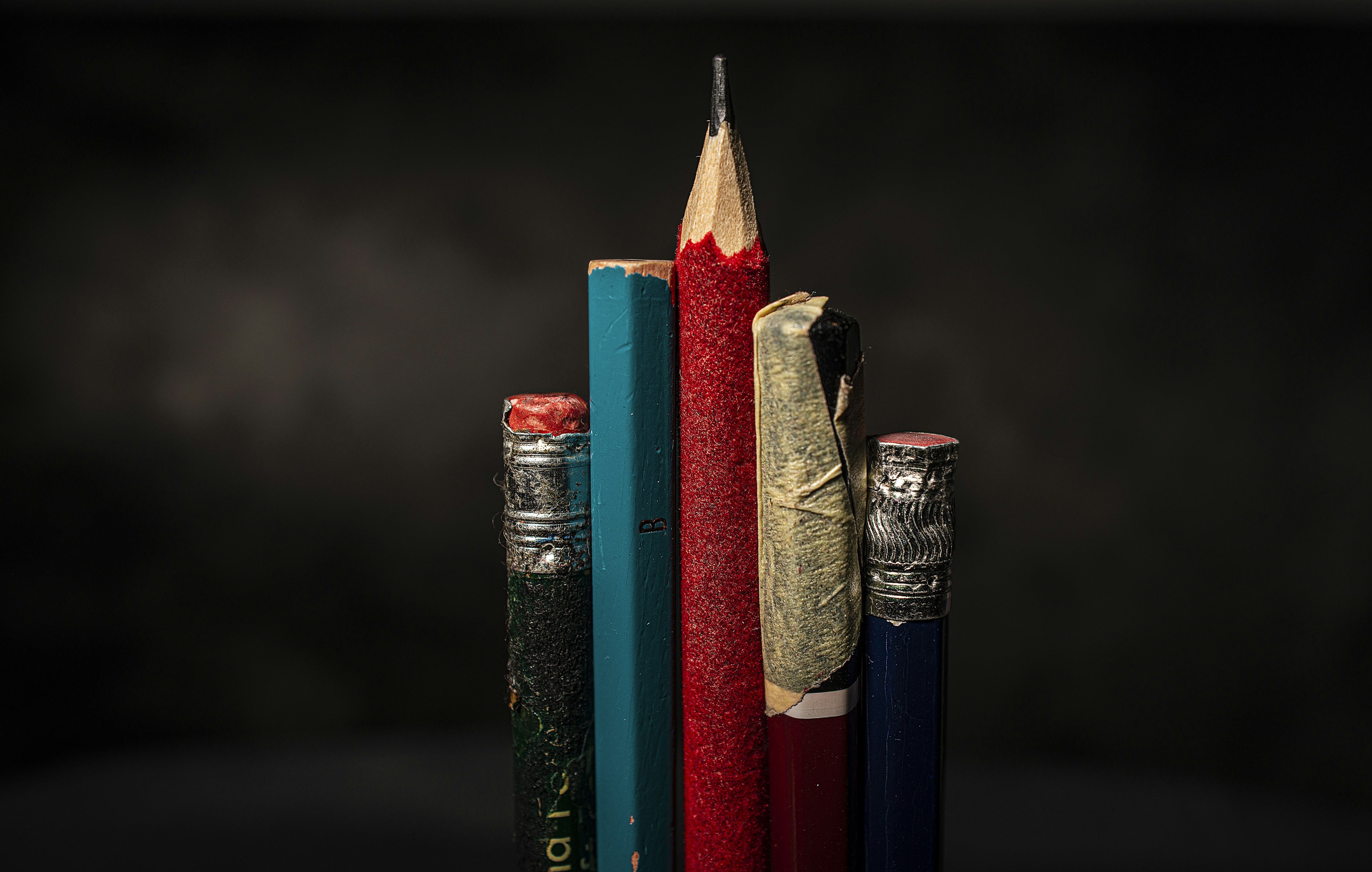 red and blue pencil on black and silver tube