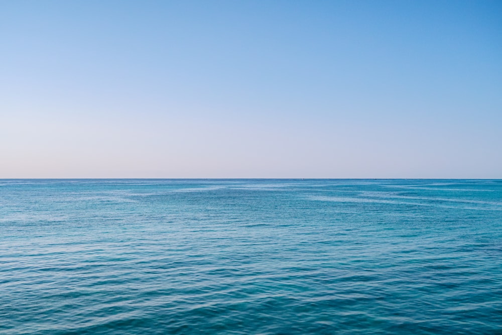 blue sea under blue sky during daytime