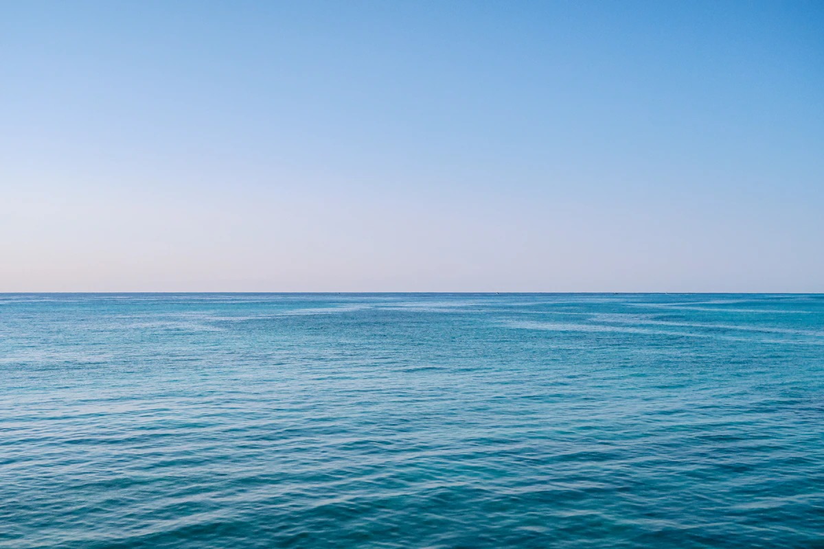 blue sea under blue sky during daytime