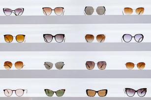 black framed sunglasses on white surface