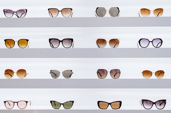 black framed sunglasses on white surface