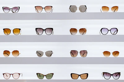 black framed sunglasses on white surface