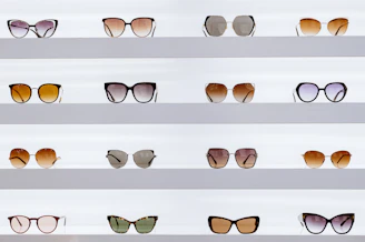 black framed sunglasses on white surface