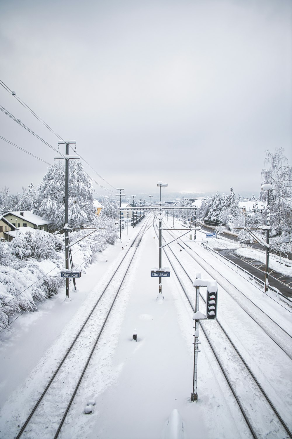 snow covered road during daytime